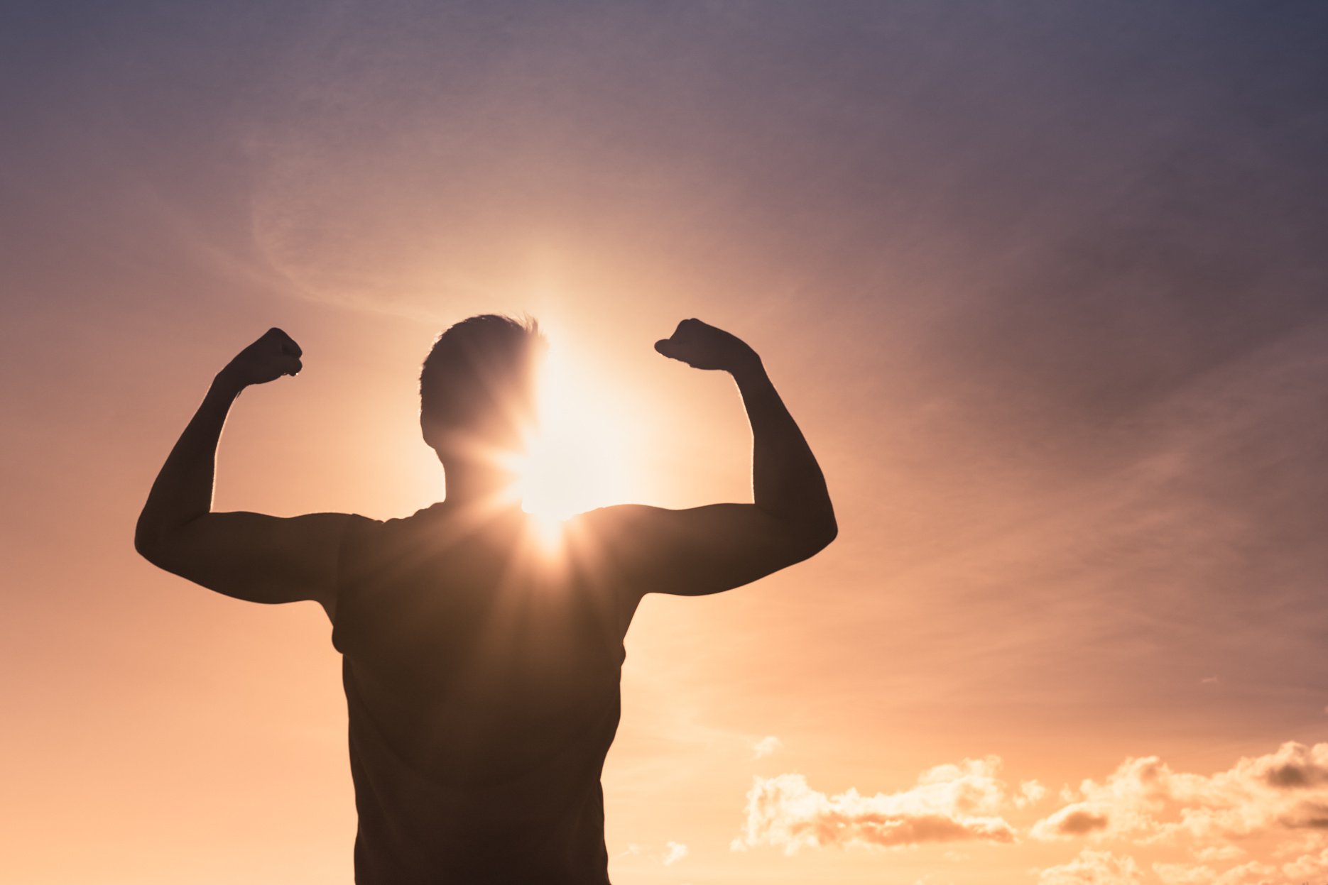 Strong man at sunset